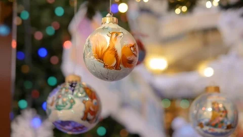 Christmas decorations hang on the tree. Beautiful balloons Video stock 70142397
