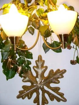 Christmas Decorations Hanging from Wall Lights Stock Photos