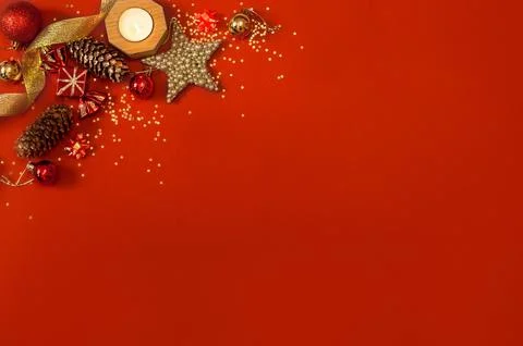 Christmas decorations on a red background in the corner of postcards Stock Photos