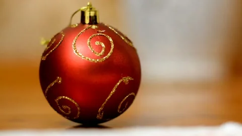 Christmas decorations roll on the floor, symbolizing the end of the holiday. Stock Footage 167374567