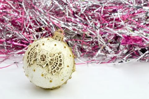 Christmas decorations round ball with a pattern and an uneven surface on a br Stock Photos