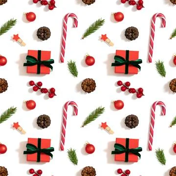 Christmas decorations seamless pattern on a white background. Gifts, fir bran Stock Photos