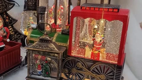 Christmas decorations with sparkles on the table. Close up of Santa Claus in the Stock Footage 294735548