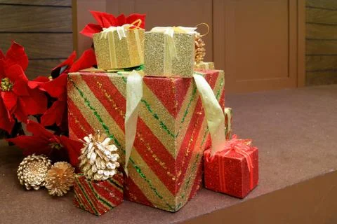 Christmas decorations with Stack of big and small gift boxes and dry pine cones Stockfoto's