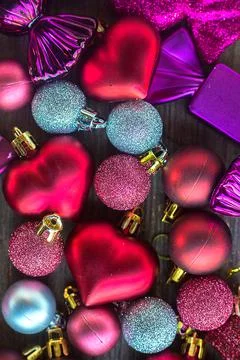 Christmas decorations. Vertical composition. Many small colourful hearts, balls Stock Photos