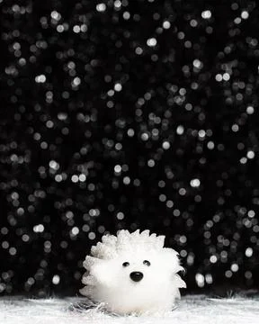 Christmas decorations view of white artificial hedgehog on dark background Stock Photos