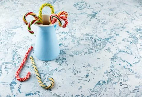 Christmas decors with light background. Candy cane. Stock Photos