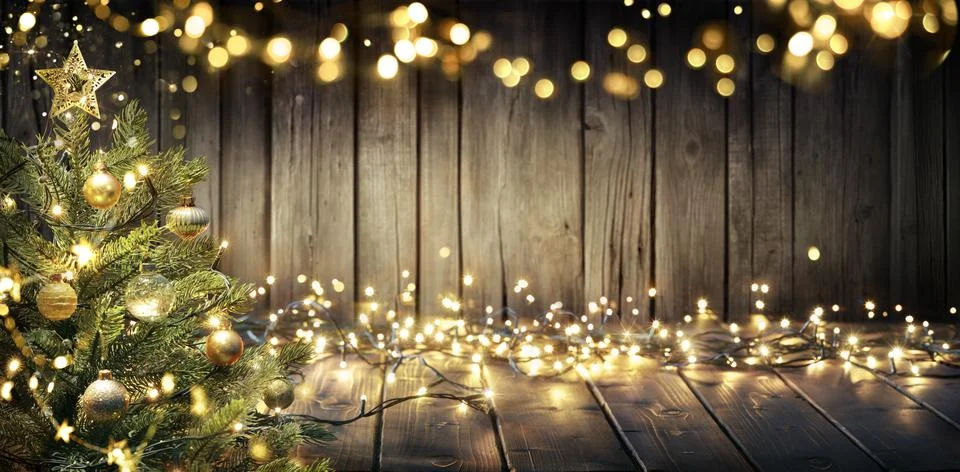 Christmas - Defocused String Light On Rustic Wooden Table With Christmas Tree Stock Photos