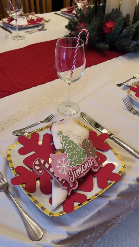 Christmas dining table set with decor on plates Stock Footage 327304937