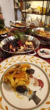 Christmas dinner with a decorated table Stock Photos