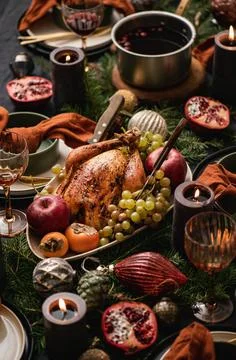 Christmas dinner festive table setting over black linen tablecloth Stock Photos