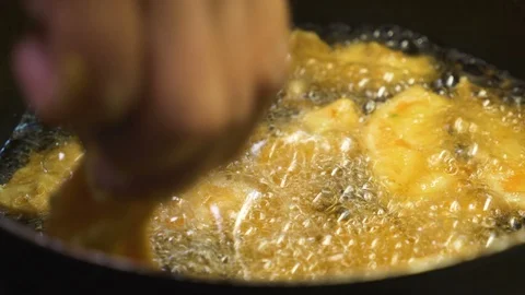 Christmas dinner: frying the cod - close up Stock Footage 90492961