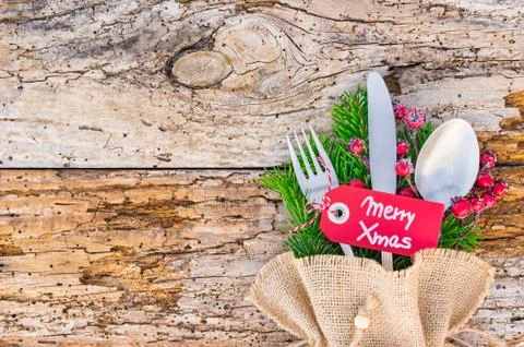 Christmas dinner table place setting, with tag Merry Christmas Stock Photos