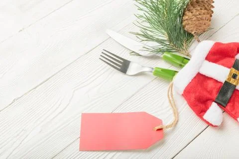 Christmas dinner table setting price concept with fork and knife Stock Photos