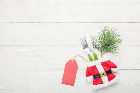 Christmas dinner table setting price concept. Fork with knife Stock Photos