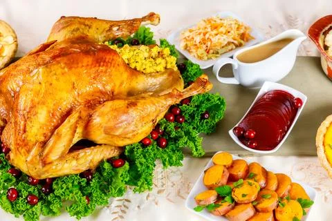 Christmas dinner turkey stuffed with cornbread mix. Stock Photos