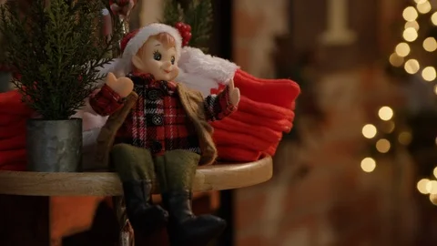 Christmas Elf Doll on a Small Shelf Stock Footage 121812592