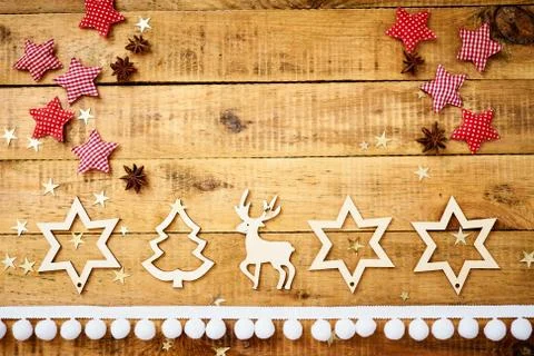 Christmas Eve background on an old table with wooden decorations Stock Photos