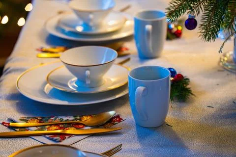Christmas Eve table setting with elegant decor and festive elements in a cozy Stock Photos