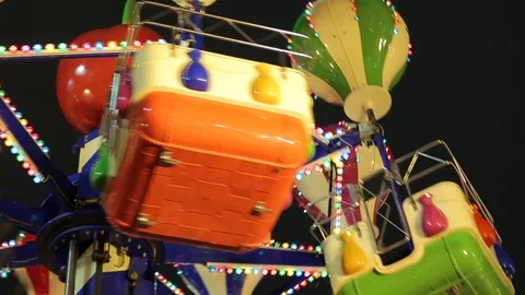 Christmas Fair. Multicolored carousel is spinning in amusement park, Holiday. Stock Footage 83668014