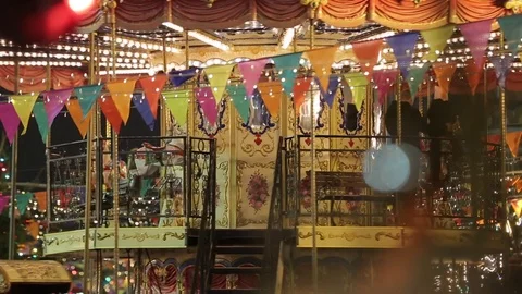 Christmas Fair. Multicolored carousel is spinning in amusement park, Holiday. Stock Footage 83668059
