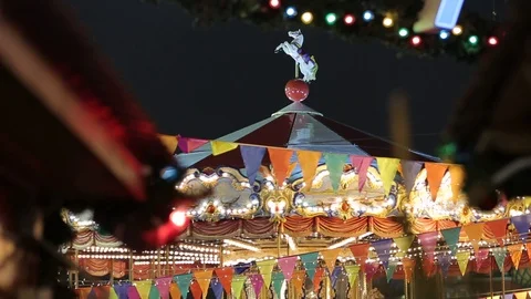Christmas Fair. Multicolored carousel is spinning in amusement park, Holiday. Stock Footage 83668063