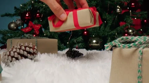 Christmas Festive Decorations Featuring Wrapped Presents and Pine Cones on Fur 库存影片 331106357