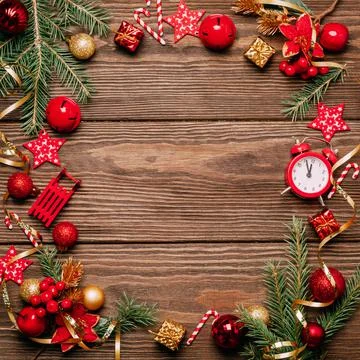 Christmas festive layout frame red balls toys bells green branches spruce Stock Photos