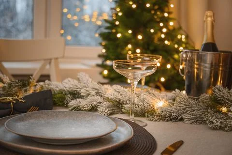 Christmas festive table setting, gold decorate and champagne. Family holida.. Stock Photos