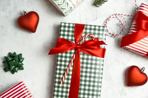 Christmas flat lay in classical red and green colors. Gift boxes,ornaments,fu Stock Photos