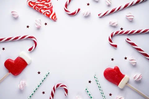 Christmas flat lay composition. Christmas candies with marshmallows on a gray Stock Photos
