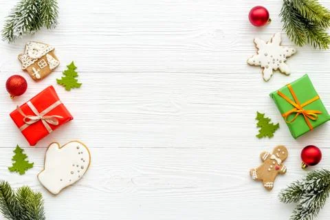 Christmas flat lay with gift boxes and icing gingerbread cookies, top view Stock Photos