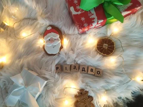 Christmas flat lay with gift boxes, cookies and christmas lights Stock Photos