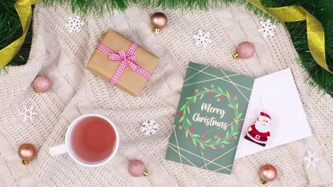 Christmas flat lay with gift, greeting card, and decorations Vidéo 345169157
