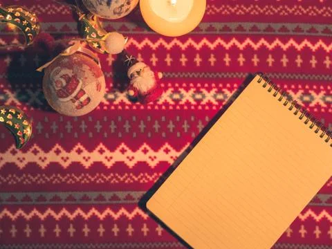Christmas flat lay. Note and toys on red pattern background Stock Photos