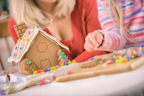 Christmas: focus on candy and icing decorated gingerbread house Stock Photos