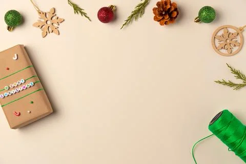 Christmas frame on beige background. Flat lay, top view. Copy space Stock Photos
