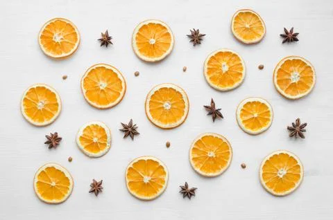 Christmas frame composition with dry oranges and anise stars and seeds Stock Photos