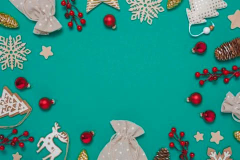 Christmas frame with decorations on teal background Stock Photos