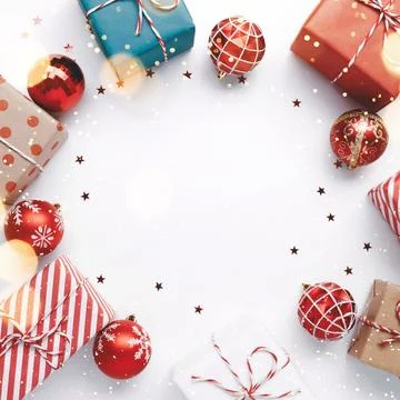 Christmas frame with gift boxes and balls on white Stock Photos