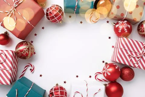 Christmas frame with gift boxes and balls on white Stock Photos