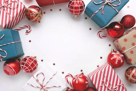 Christmas frame with gift boxes and balls on white 스톡 사진