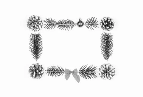Christmas frame of pine cones and fir branches on a white background. Flat la Foto stock