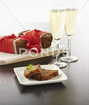 Christmas Fruit Cake And Champagne Glasses