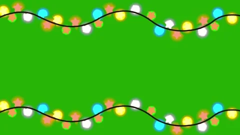Christmas garland string lights glowing on green screen background Stock Footage 320867627