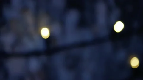 Christmas garlands on the trunk of a tree are flashing, blur. A blur of lights Stock Footage 228065047