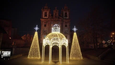 Christmas gazebo light installation in front of a historic church at night. Stock Footage 327624680