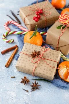 Christmas gift box, candy cane, tangerines Stock Photos