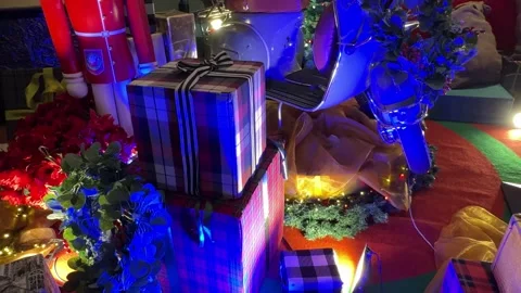 Christmas  gift box with nutcracker guards and motorcycle with icicle lights Vídeos de archivo 294935204