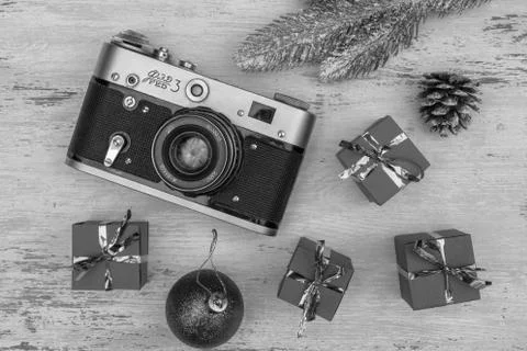 Christmas gift boxes and camera. Stock Photos